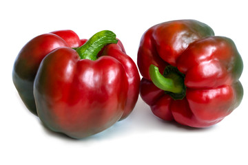 two fleshy juicy big red bell peppers