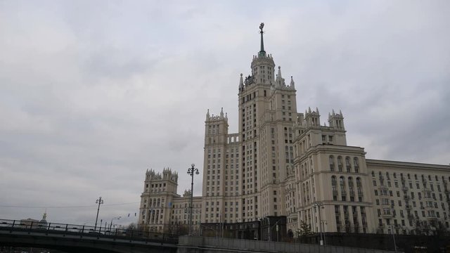 Stalin Vysotka on Kotelnicheskaya embankment view from Moscow river. Late autumn in the capital's quays. Navigable walking river.