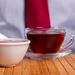 A cup of black tea and  honey