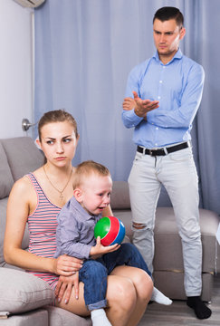 Sad male and female with child thinking about quarrel