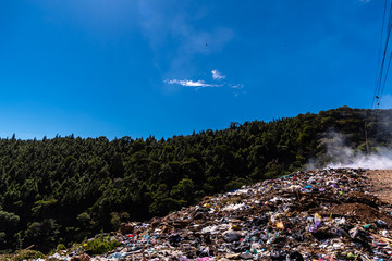 landfill dump burning trash in Guatemala