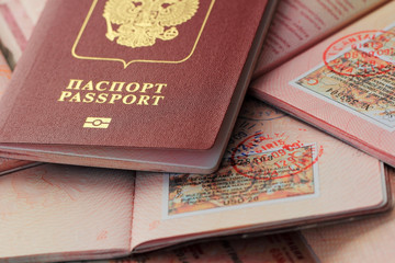 Russian passports and visa immigration stamps. Background of documents