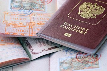 Russian passports and visa immigration stamps. Background of documents