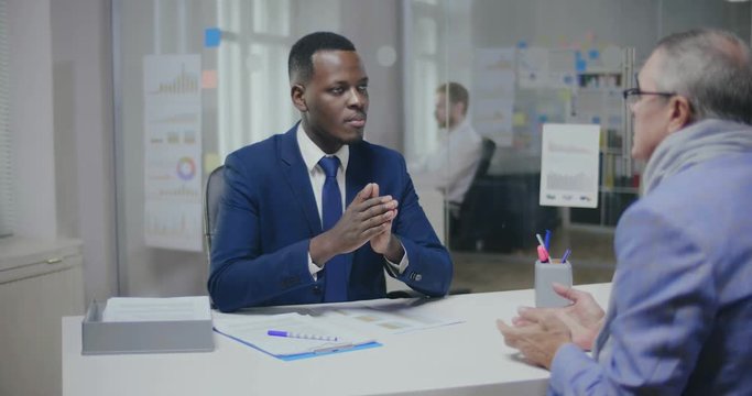 Civil-law african notary consulting his elderly client