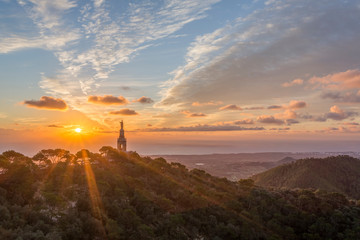 Sunrise over the statue of Christ at the Sant Salvador sanctuary and monastery, Mallorca