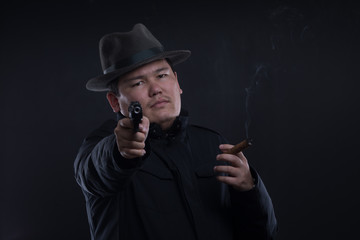 asian yakuza man with a gun