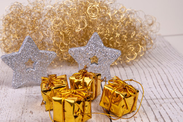 golden presents against silver stars an golden angel hair