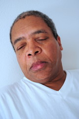 Obraz premium African american male relaxing in bed at home.