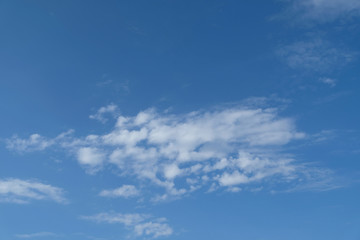 Image of beautiful sunshine day with  blue sky, white clouds and copy space pattern, texture, wallpaper and background. 