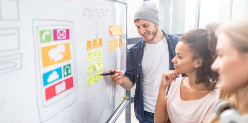 Designers drawing website ux app development.