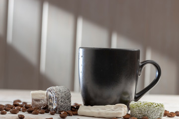 Cup of coffee and sweets Turkish delight on white table