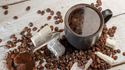 Cup of coffee and sweets Turkish delight on white table