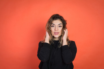 Fototapeta premium red background, studio photography, beautiful girl