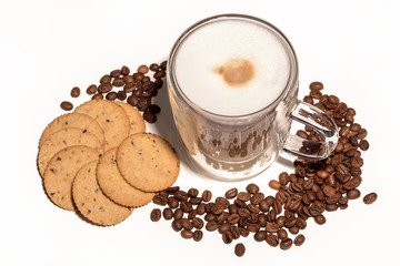 Cup with coffee, cookies and scattered coffee beans