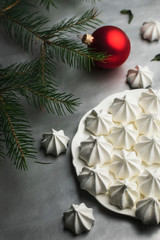 white meringues on a silver background