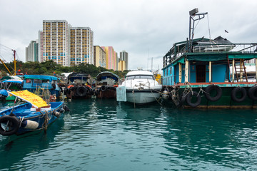 Fototapeta na wymiar Typical house boats at the Aberdeen floating village, located in Aberdeen harbour, Hong Kong