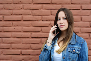 Young woman talking on her mobile phone.