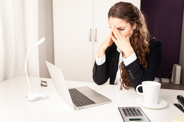 Young Business Woman working sitting at desk stressed out angry on laptop