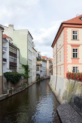 Fototapeta na wymiar Charming houses on the river canal in Prague, Czech Republic