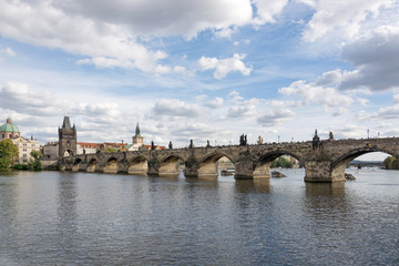 Panoramic view of Charles bridge and Vltava river on a cloudy summer day, in Prague, Czech Republic