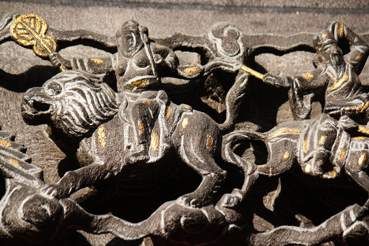 Stone carving relief arts and decoration in a temple in downtown Taichung city, Taiwan, China, Asia