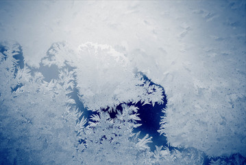 Frost on the glass on blue background