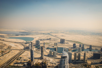 Buildings, streets and the desert of Dubai