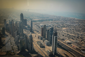 Buildings, streets and the desert of Dubai