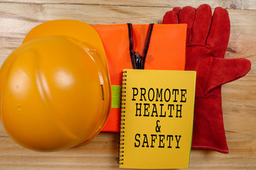 HEALTH,SAFETY & ENVIRONMENT CONCEPTUAL with general texts and standard construction safety equipment.