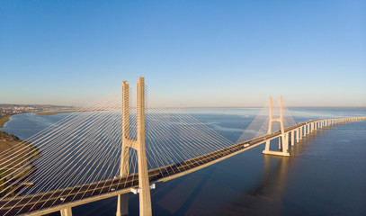 Vasco da Gama Bridge landscape at sunrise. One of the longest bridges in the world. Lisbon is an...