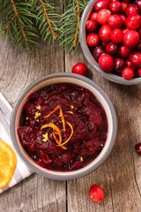Homemade Cranberry sauce on festive holiday background
