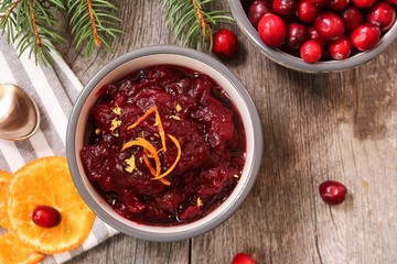 Homemade Cranberry sauce on festive holiday background