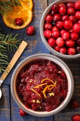 Homemade Cranberry sauce on festive holiday background