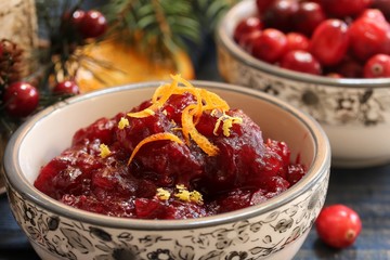 Homemade Cranberry sauce on festive holiday background