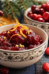 Homemade Cranberry sauce on festive holiday background