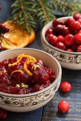 Homemade Cranberry sauce on festive holiday background