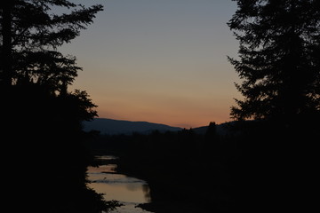 Sunset by river