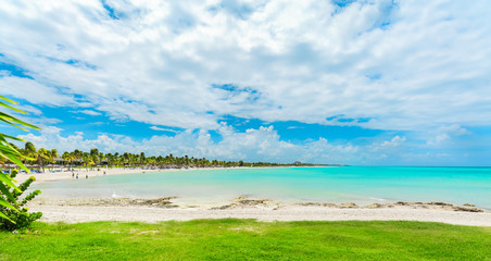 Varadero, Cuba, stunning gorgeous inviting view from tropical garden on Cuban Varadero beach lagoon, tranquil turquoise tender ocean against blue sky background on sunny summer day