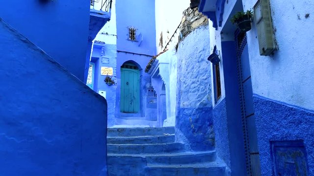 Walking in the street in old blue medina of the Chefchaouen City, Morocco, Africa