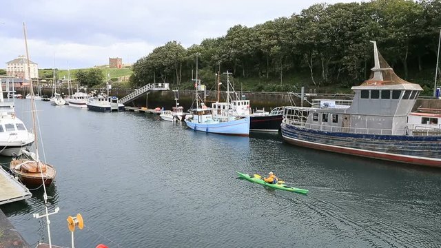 Eyemouth Harbor marina kayak boats Scotland HD. Small coastal town and civil parish in Berwickshire. On English Scottish border. Traditional fishing port, harbor and marina. 