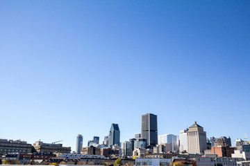 Montreal skyline, with the iconic buildings of the old Montreal (Vieux Montreal) and the CBD business skyscrapers taken from the port. Montreal is the main city of Quebec, & the second city in Canada
