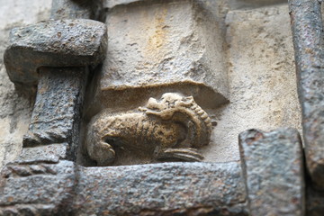 Dijon,France-October 14, 2018: Dragon carved in relief on north wall of Eglise Notre-Dame de Dijon or Church of Notre-Dame in Dijon, France
