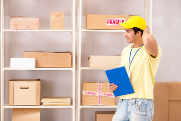 Handsome contractor working in box delivery relocation service 