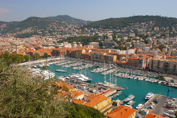 Fototapeta na wymiar Sailboats, Boats, and Homes on a harbor in Nice, France