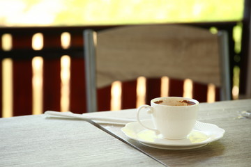 Used coffee cup put on the top of table.