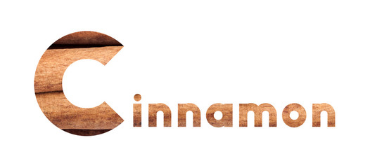 The word Cinnamon with cinnamon sticks isolated on white