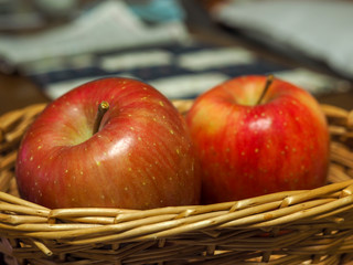 Two apples in basket.