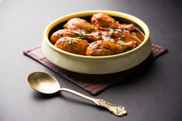 Chicken leg / drumstick curry or Murg Tangri/tangdi masala. Served in a bowl over moody background. Selective focus