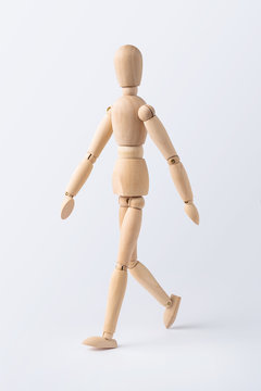 walk wooden mannequin isolated on white background