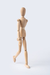 walk wooden mannequin isolated on white background